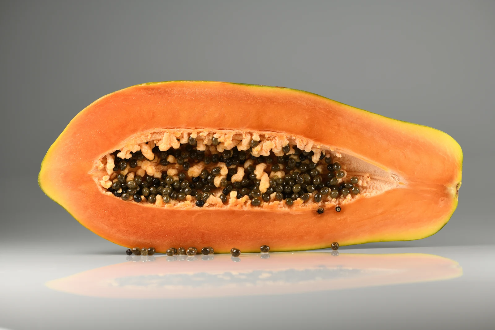 Fresh papaya cut in half, an example of seasonal fruit