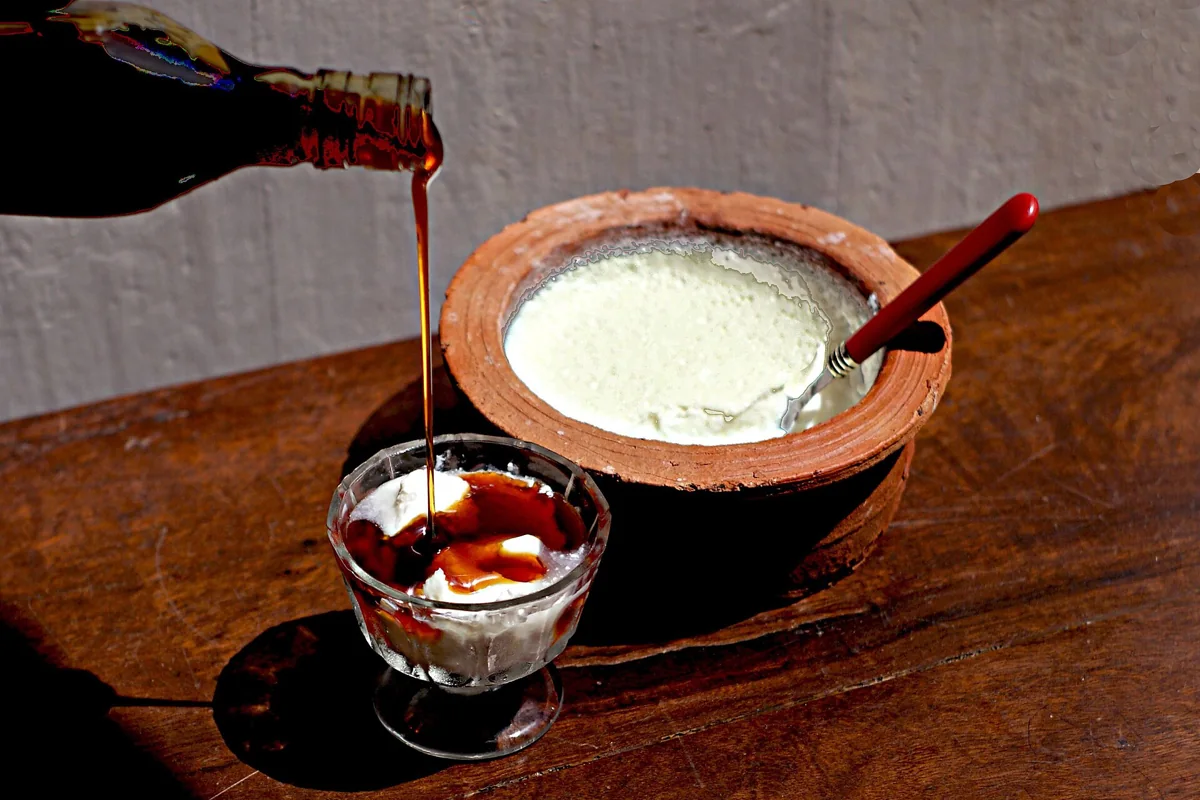 Buffalo curd served with treacle.